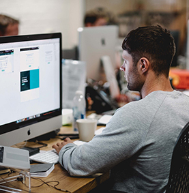 Man at a computer in an office