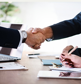 People shaking hands in an office